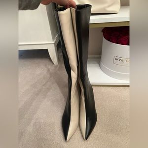 Super cute and Comfortable Black and White boots. Worn one time.